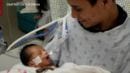 Baby cut from teen mother's womb in Chicago opens eyes for the first time while being held by dad