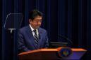 Japan's Abe vows unprecedented stimulus as Tokyo virus cases rise